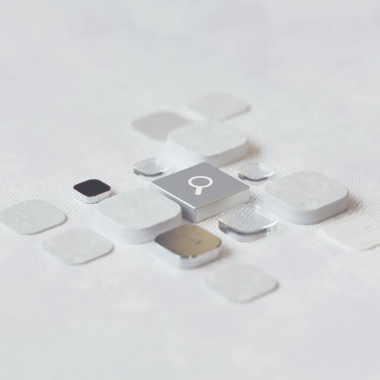 White background with subtle tech logos placed on thich cubes