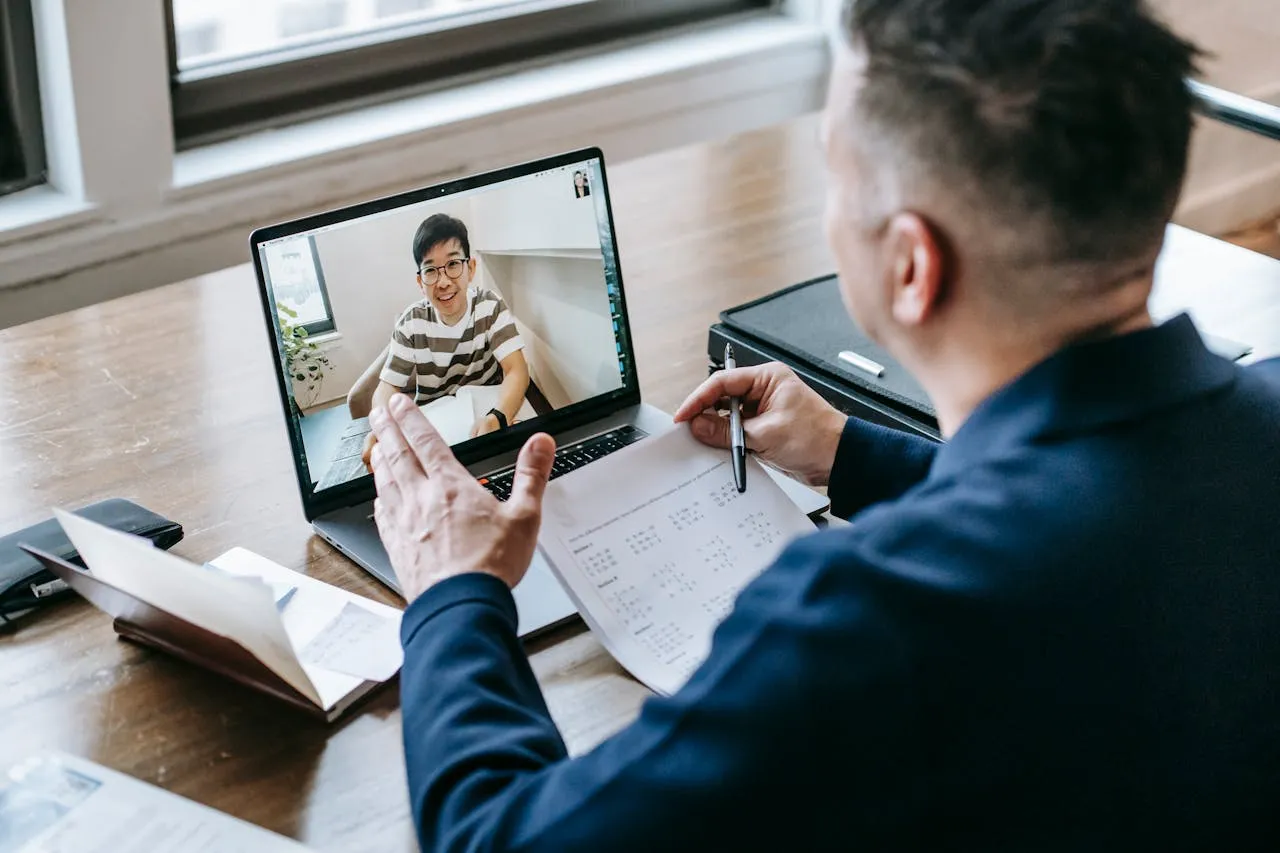 Professor teaching his student online