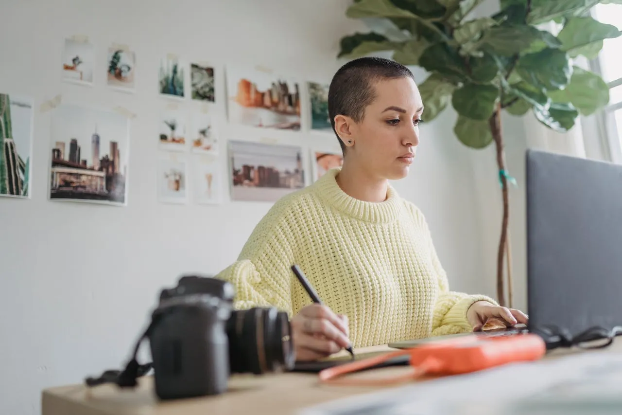 A girl designing something using stylus